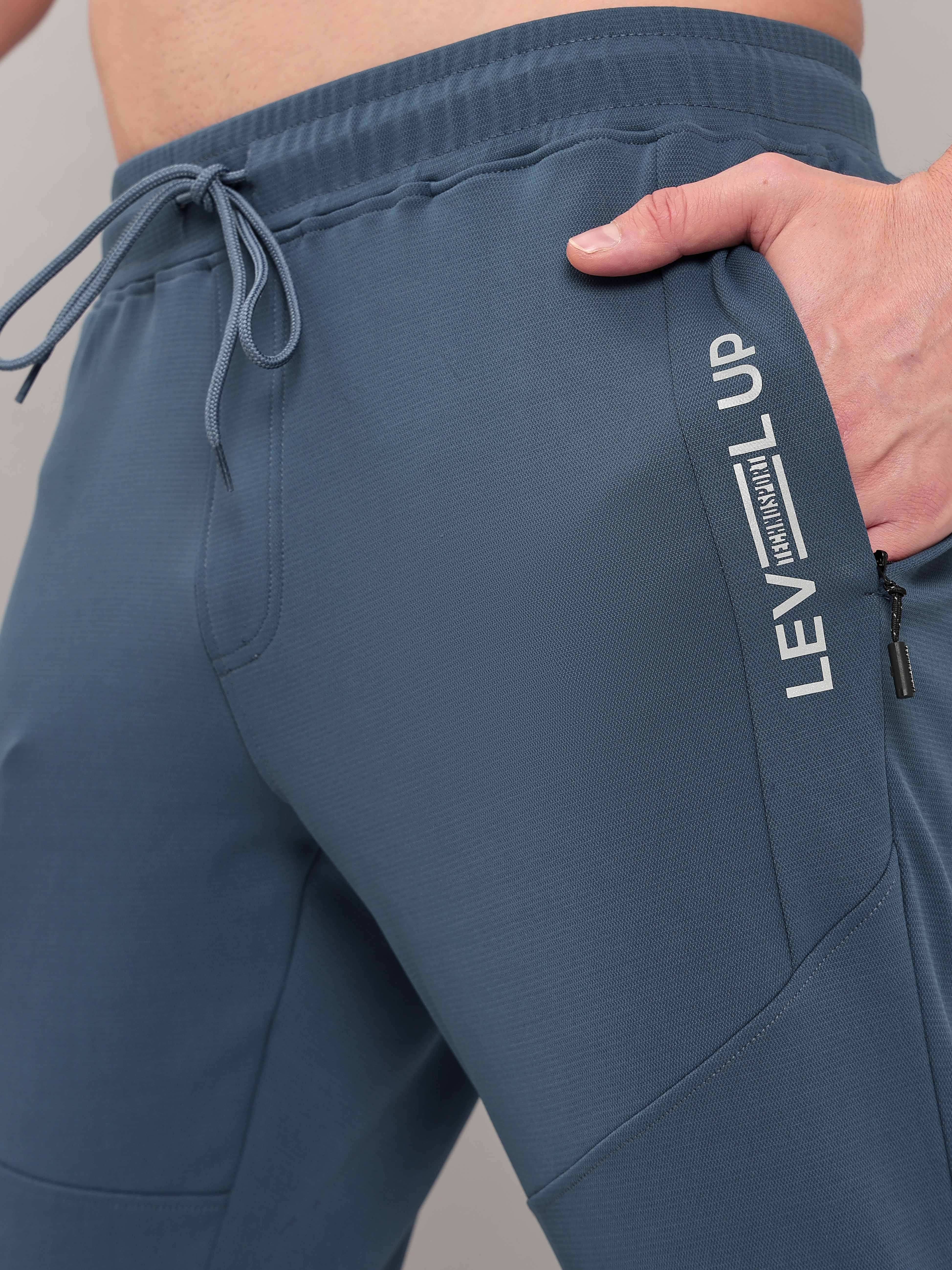 Men Solid Slim Fit Trackpants with TECHNO DRY - Image 6