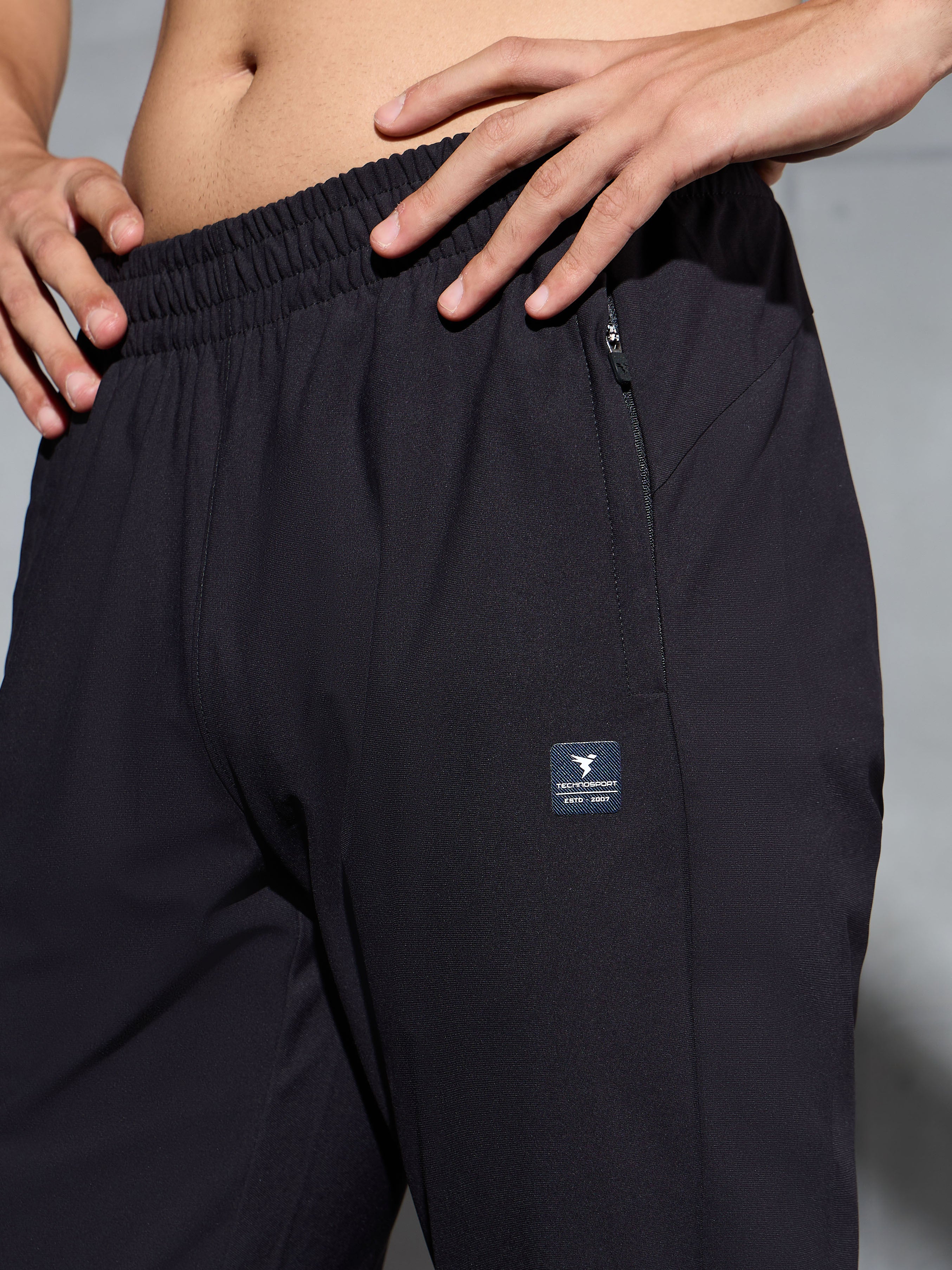 Men Solid Straight Fit Sports Trackpants with DURACOOL+ - Image 6